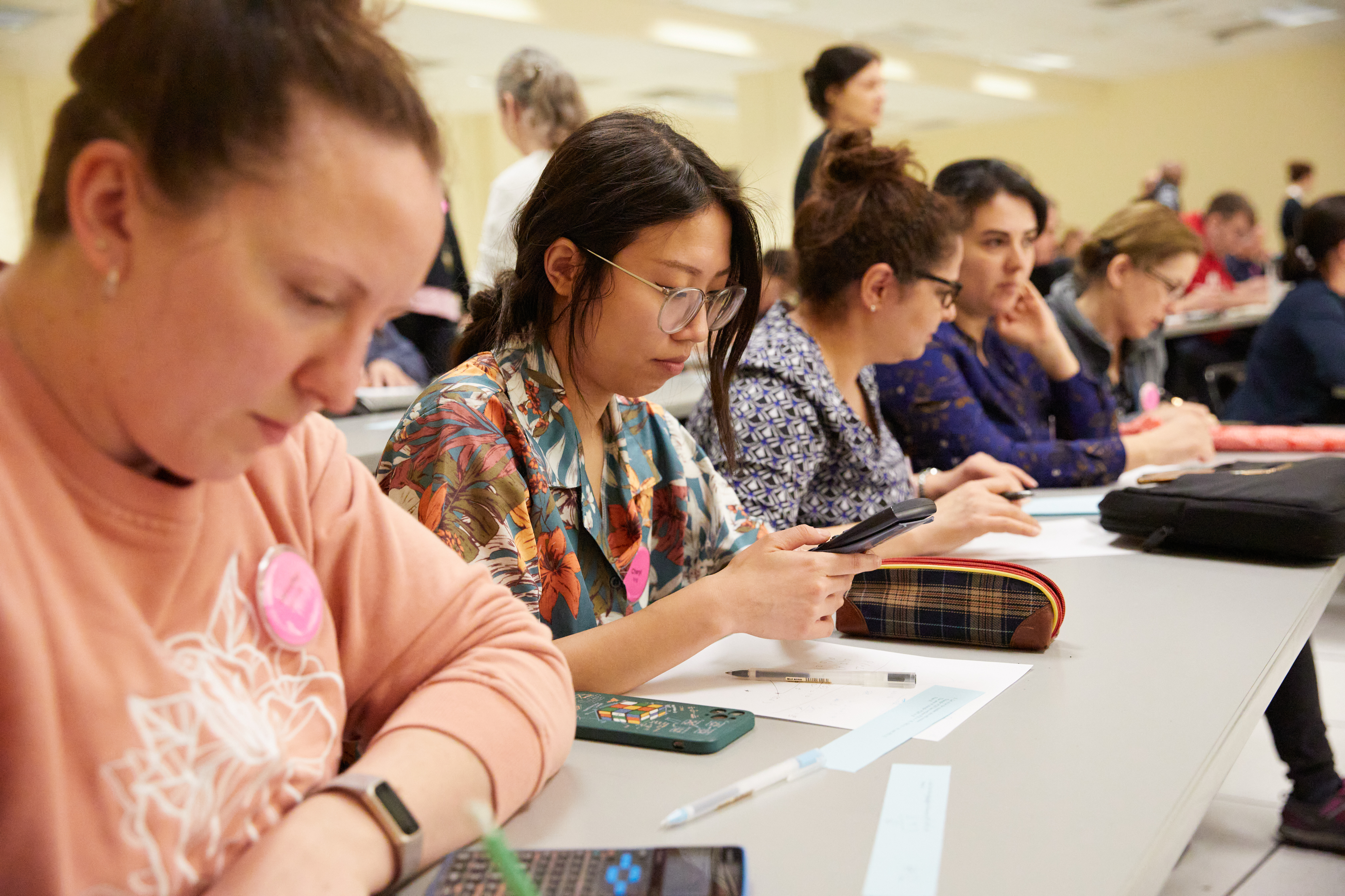 Young woman solving math problems in the classroom