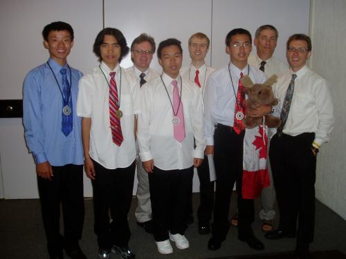 IOI 2006 team from Canada:  Peng Shi, Qiyu Zhu, Gordon Cormack, Andy Kong, Graeme Kemkes, Richard Peng (with mascot), Ian Munro, and Troy Vasiga