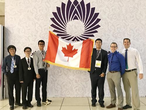 IOI 2017 team from Canada - Brian Chau, Jason Yuen, Leo Feng and Joey Yu, Troy Vasiga, and J.P. Pretti