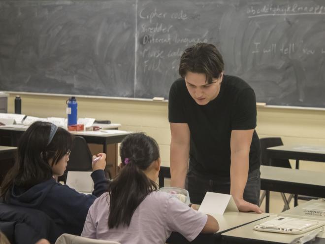 Educator with students during a CEMC workshop