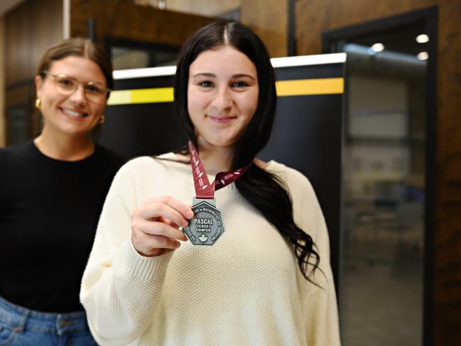 Student with CEMC medal