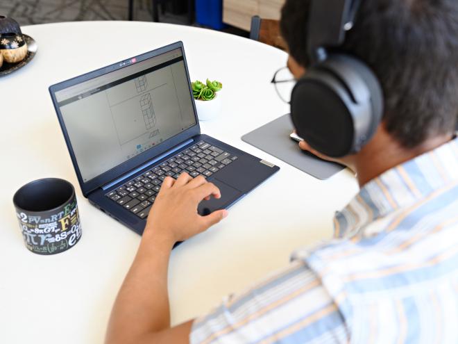 Student accessing CEMC resources on the laptop