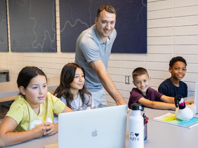 Elementary school students with their math teacher. 